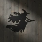 Metalowa dekoracja czarownica lecąca na miotle – ozdoba na Halloween
