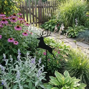 Metalowa dekoracja ogrodowa do wbicia Jeleń Skoczek wśród kwiatów i traw