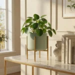 Donica metalowa na stojaku Linea seledynowa – nowoczesny kwietnik z rośliną, elegancka dekoracja wnętrza